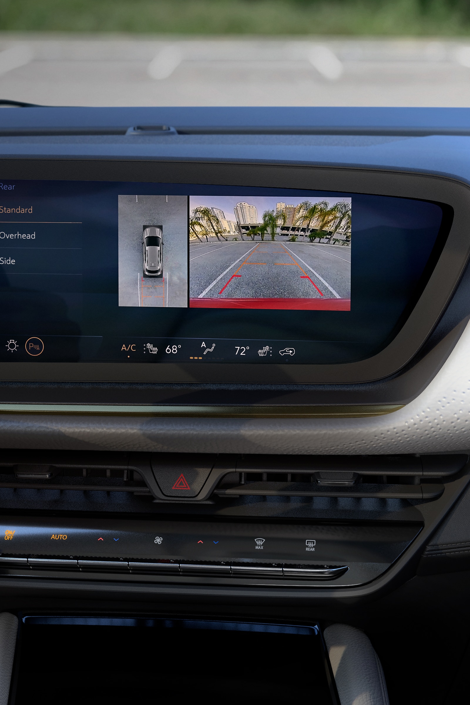 Buick Car Dashboard with a Digital Screen Displaying a Backup Camera View and Top-Down Vehicle Graphic