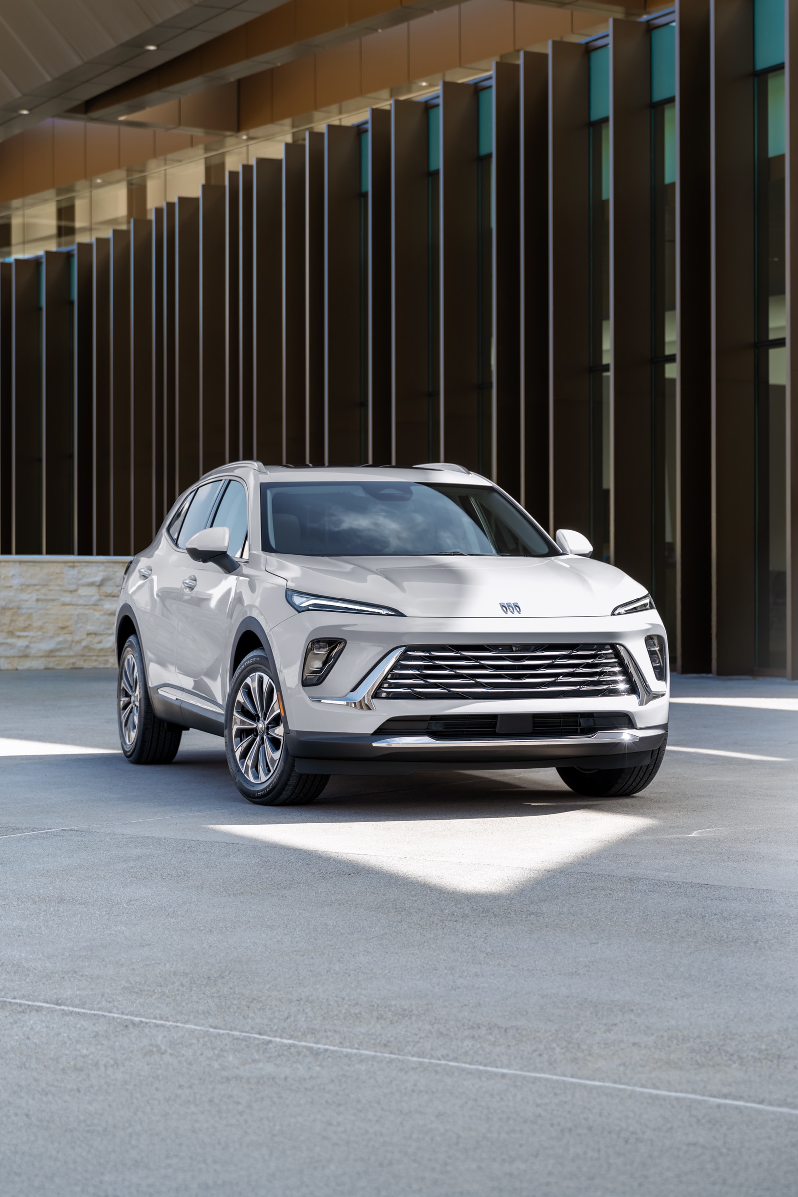 A White Buick SUV Angled Towards the Left in a Modern Setting