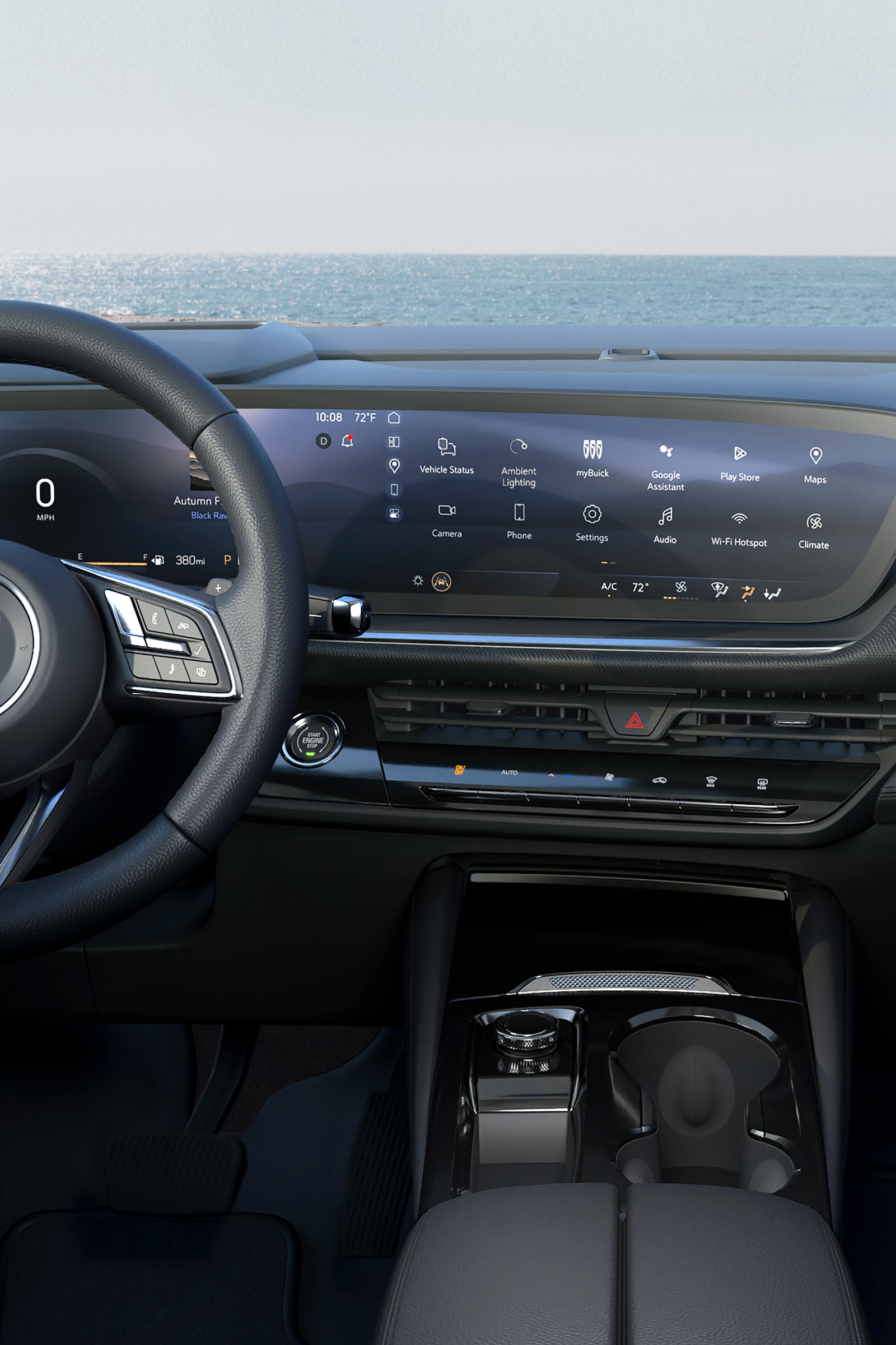 The Interior of a Buick Car with a Steering Wheel and a Large Panoramic Digital Display Showing Technology Features