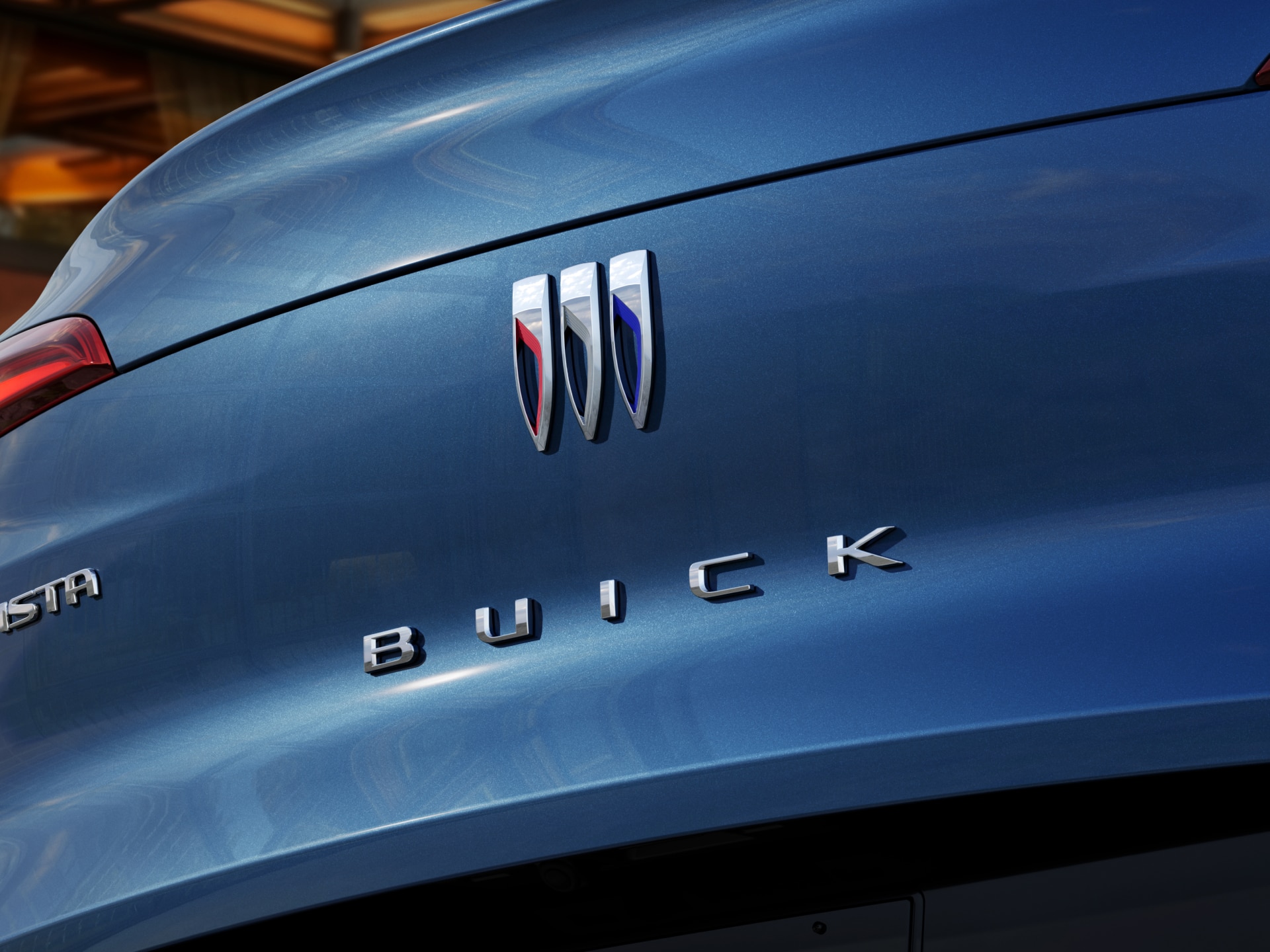 A Close-Up View of the Buick Logo and Nameplate on the Rear of a Blue Buick Envista