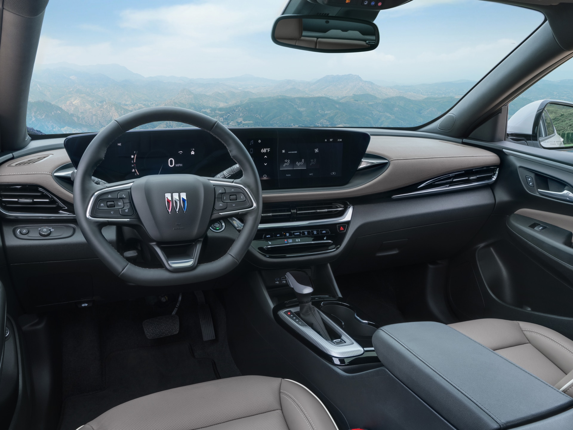 Interior Dashboard and Steering Wheel of a Buick SUV with a Scenic Mountain View