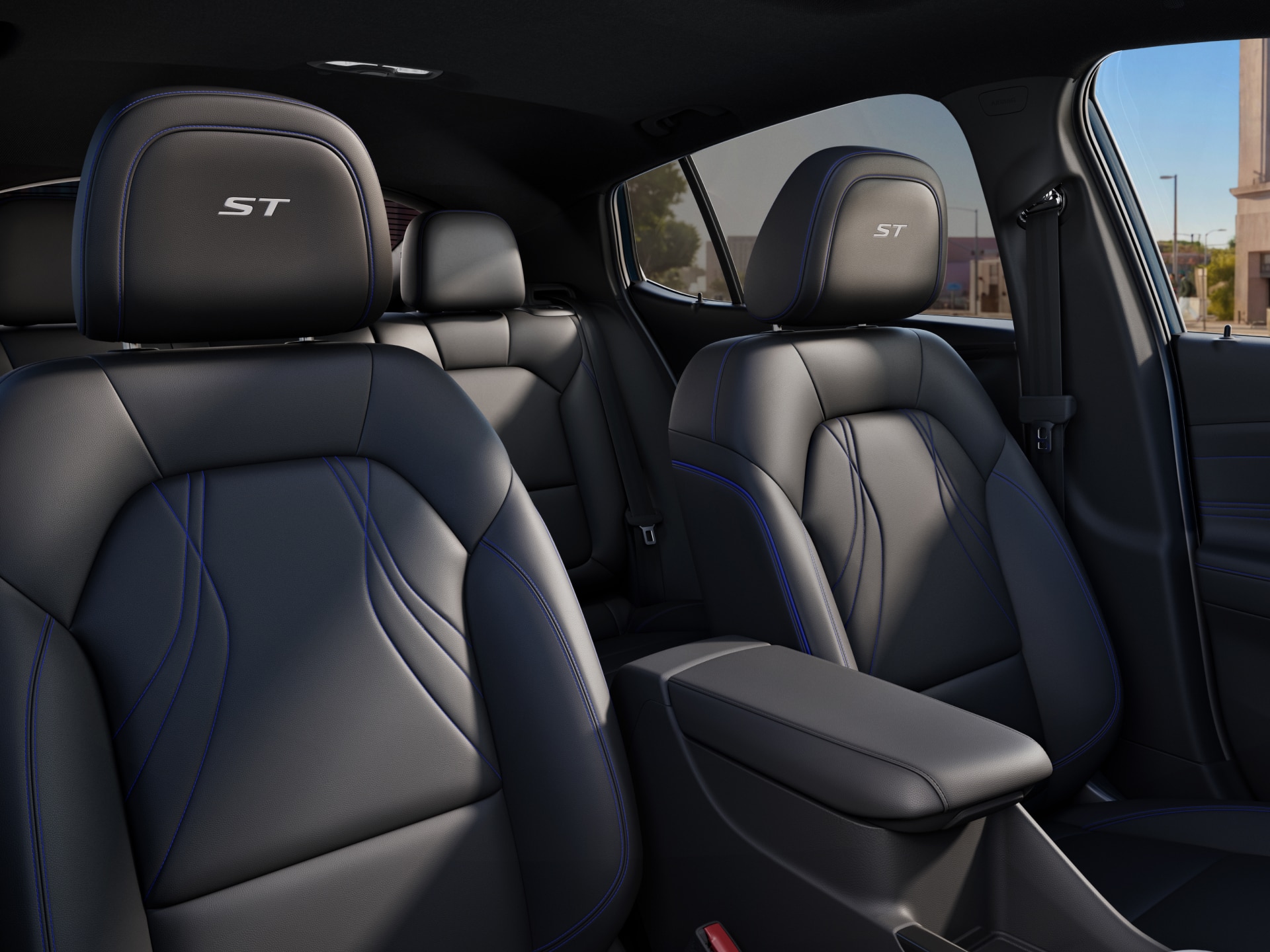 Black Leather Seats with Blue Stitching and the ST Logo on the Headrest of a Buick