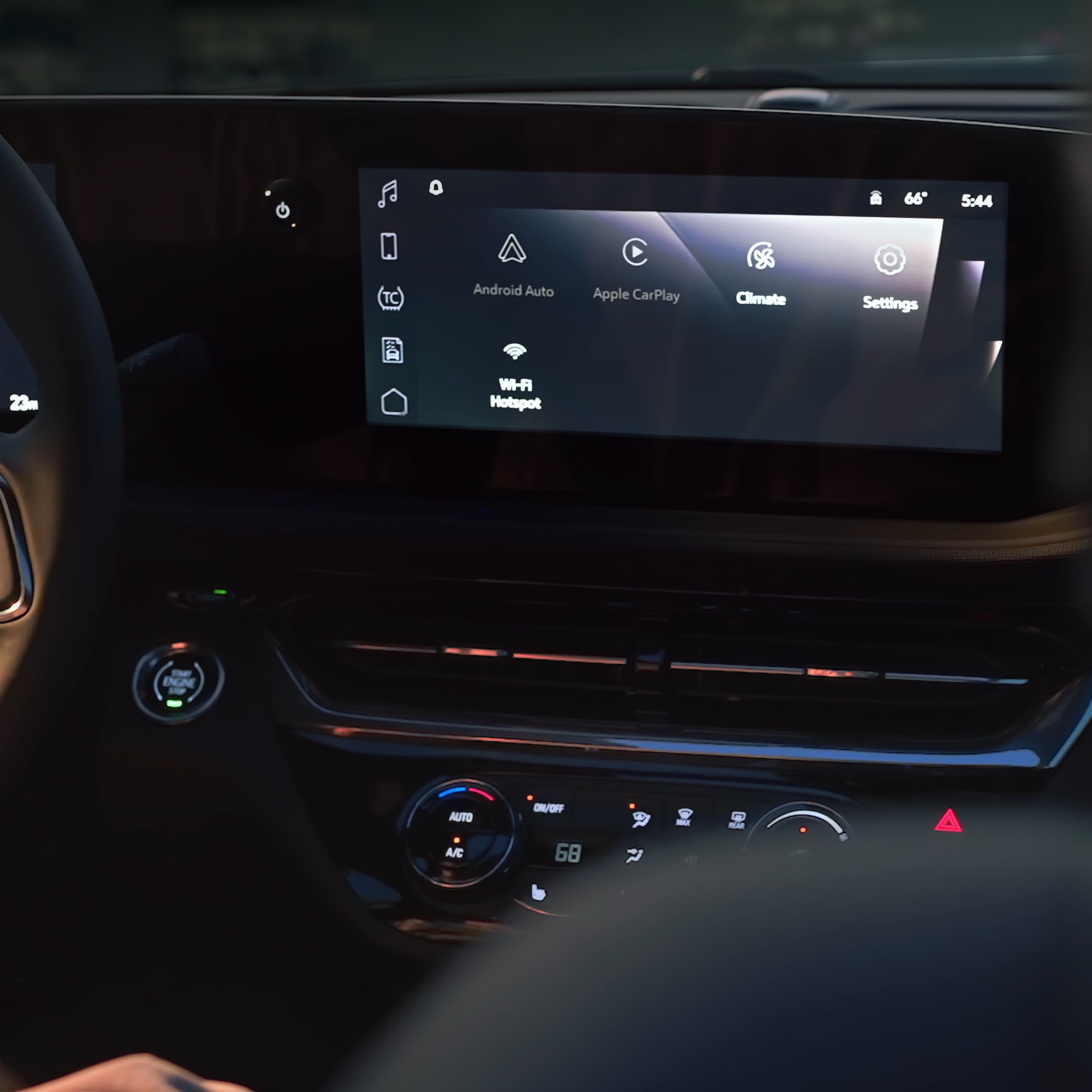 The Interior Dashboard of a Buick Vehicle with a Large Infotainment Screen Showing Options Like Android Auto, Apple CarPlay, and Climate