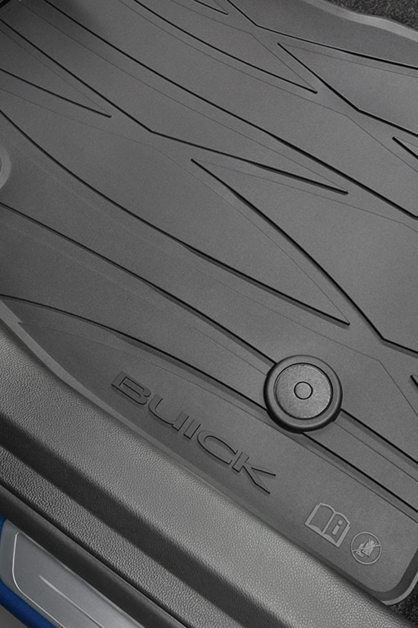 A Close-Up of a Black All-Weather Buick Floor Mat with the Word Buick Embossed on it