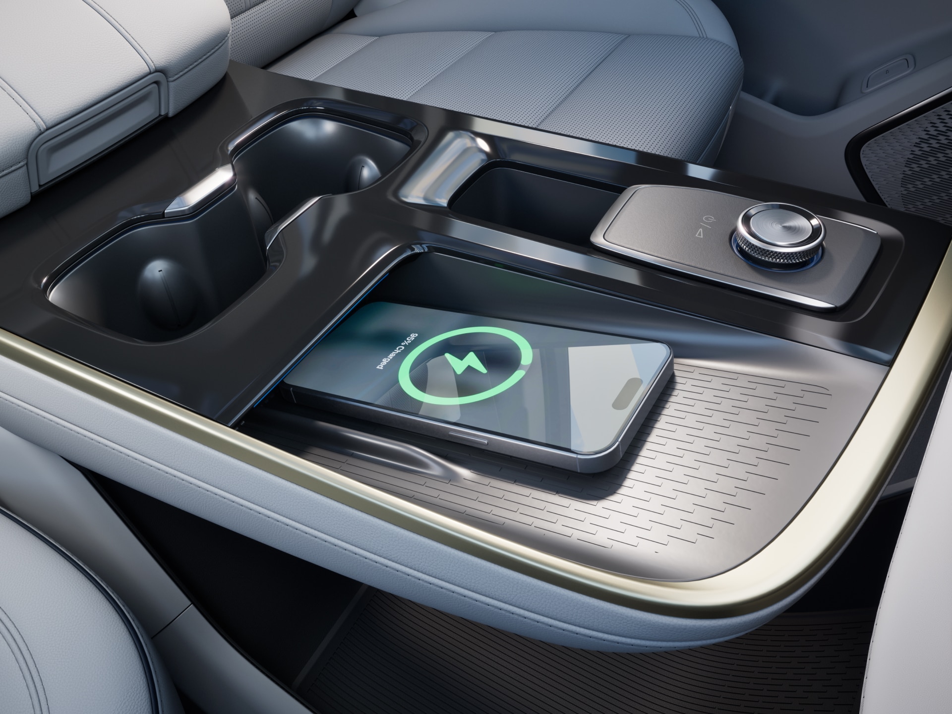 A Close-Up of a Buick Vehicle's Center Console with a Smartphone Wirelessly Charging