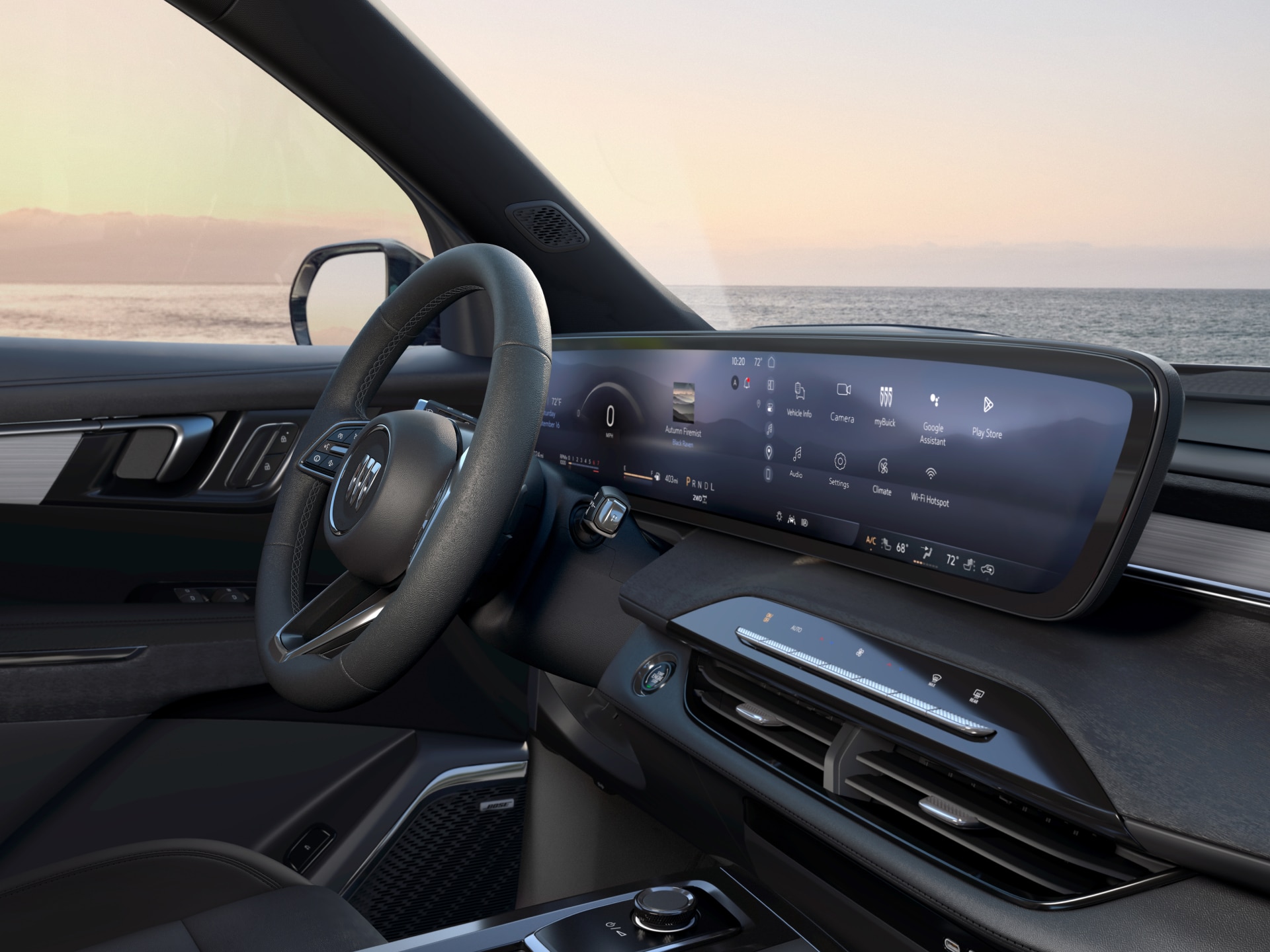 The Interior of a Buick Vehicle With a Wide Digital Display and the Ocean Visible Through the Window