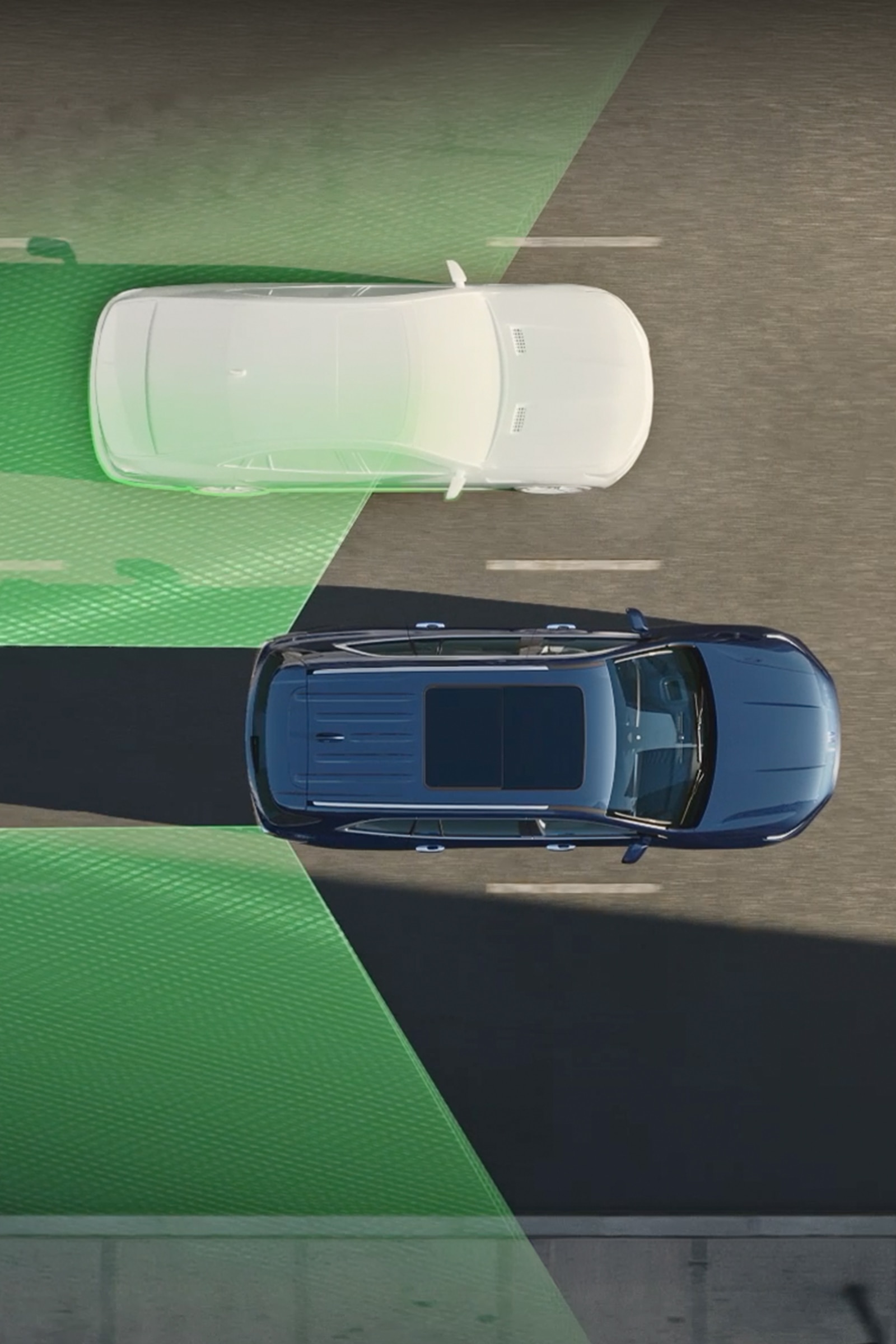 An Overhead View of a Dark Blue Buick Enclave SUV on a Road With Green Safety Zones Highlighted