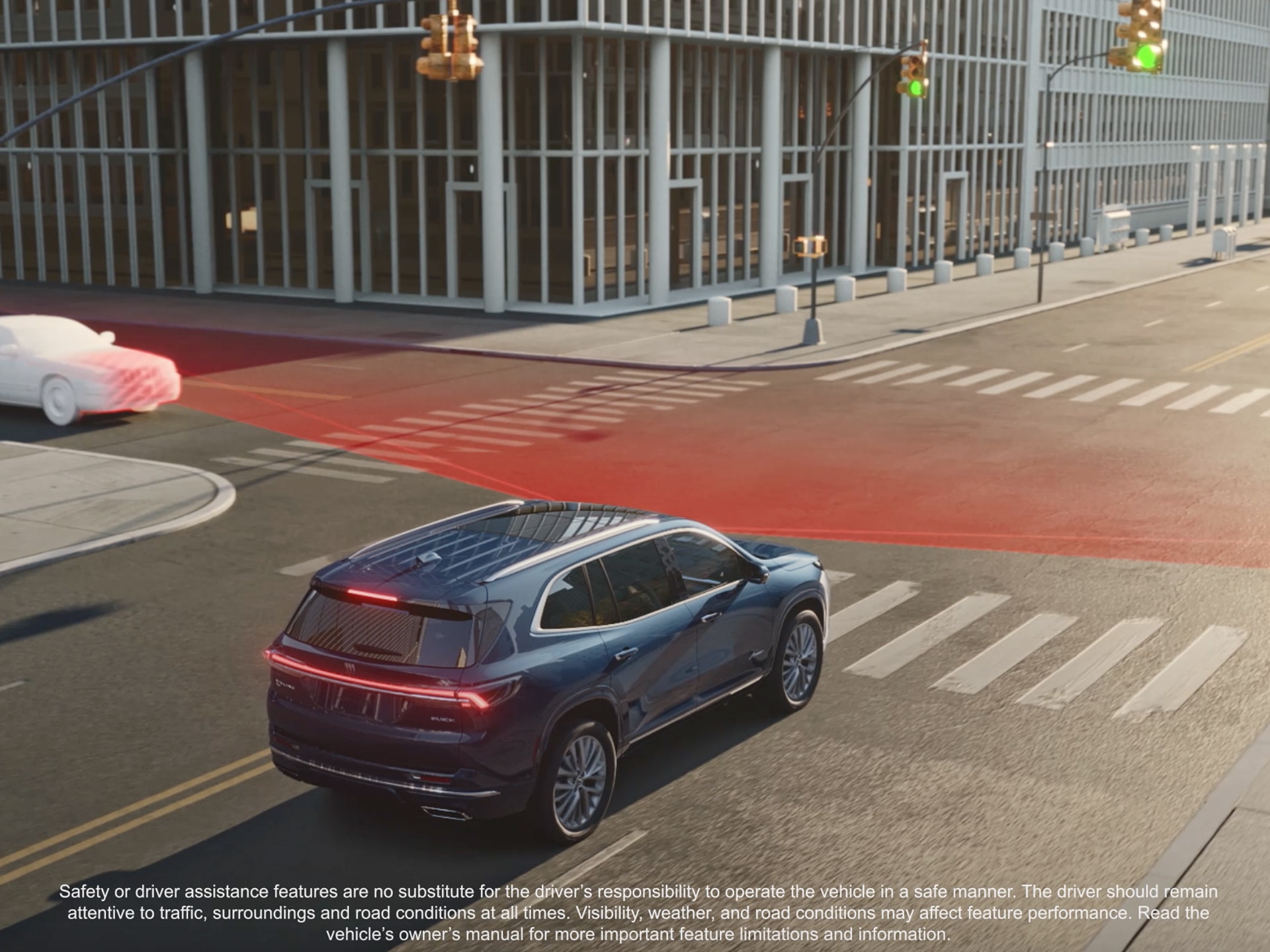 An Aerial View of a Dark Blue Buick Enclave SUV Turning at an Intersection With Red Safety Lines Indicating an Alert