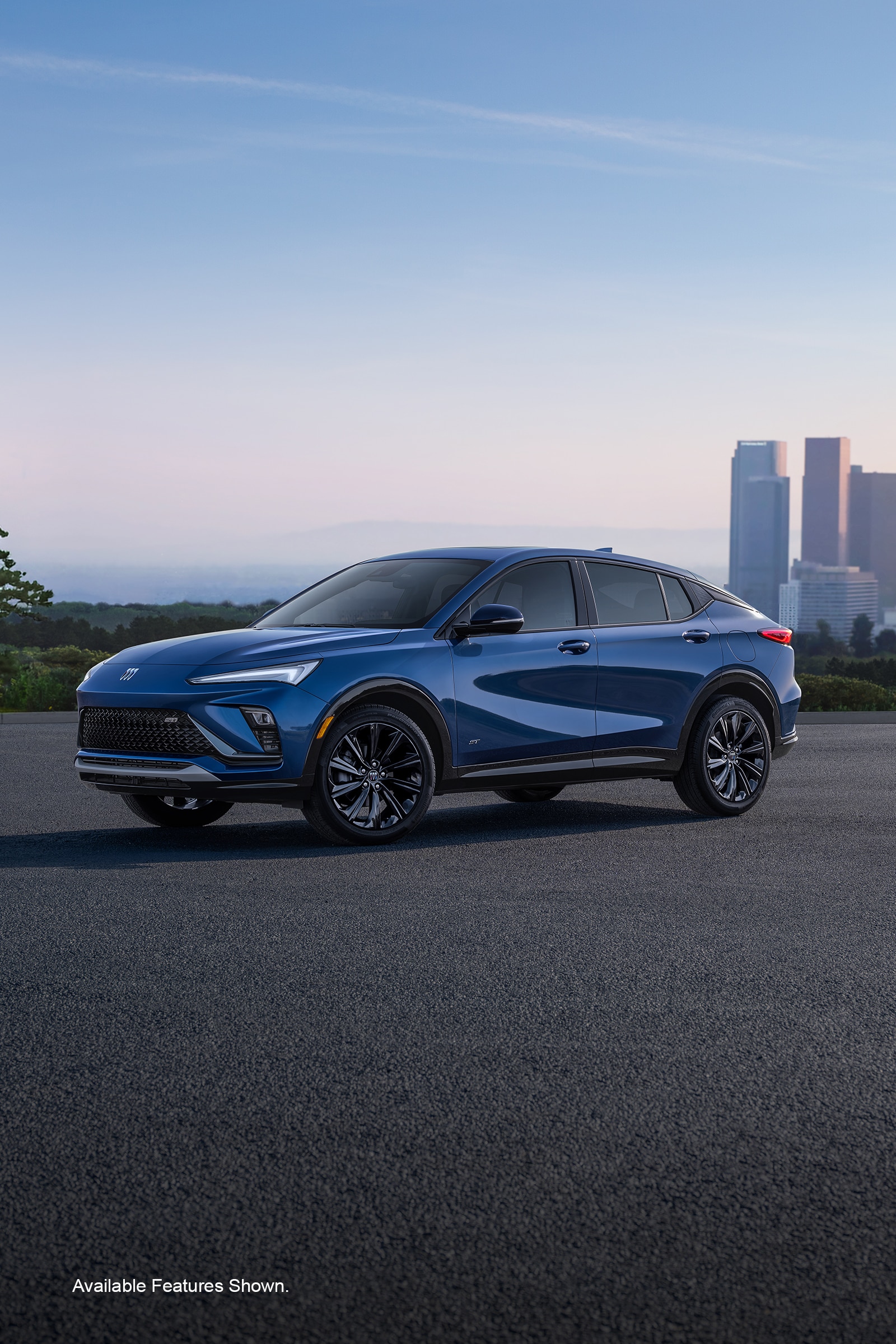 Image of a Blue 2026 Buick Envista Driving Away from the City