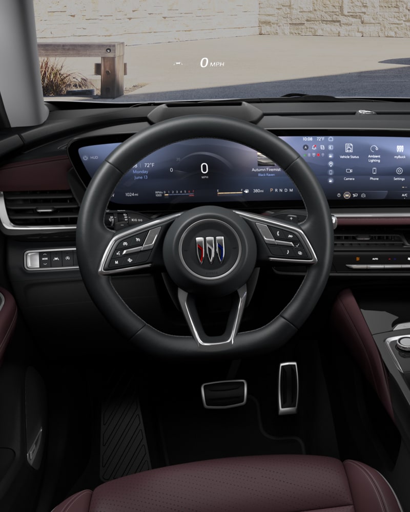 Close-up of the Buick Envision ST Interior Drivers Side View of the Steering Wheel and Dashboard