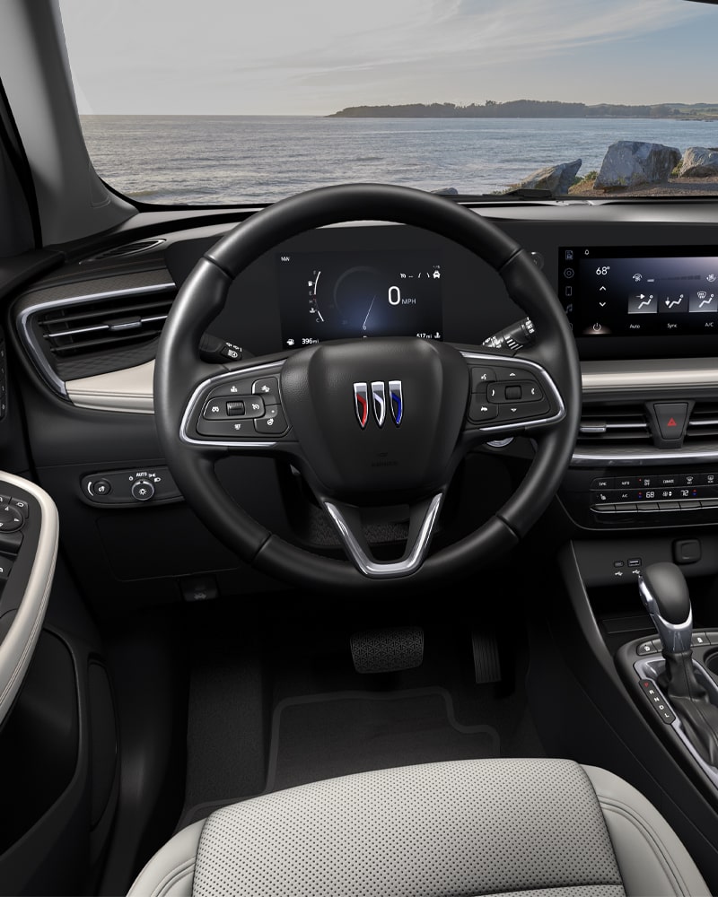Close-up of the Buick Encore GX Avenir Interior Drivers Side View of the Steering Wheel and Dashboard