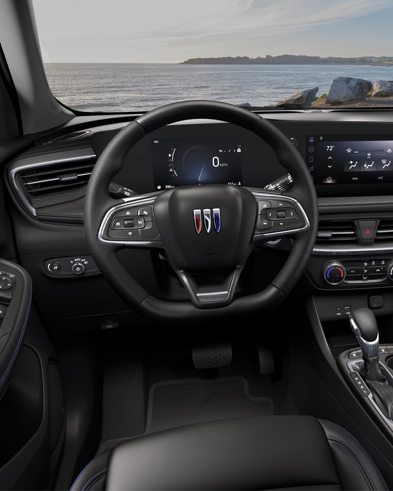 Close-up of the Buick Encore GX ST Interior Drivers Side View of the Steering Wheel and Dashboard