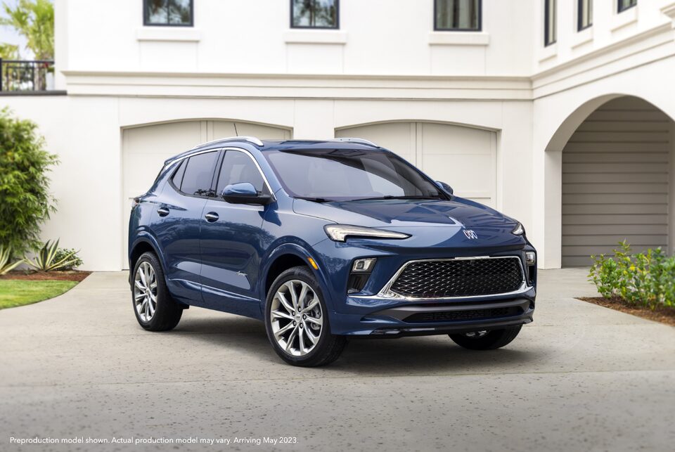 The Buick Encore GX Avenir Parked in the Drive of a Luxurious Home