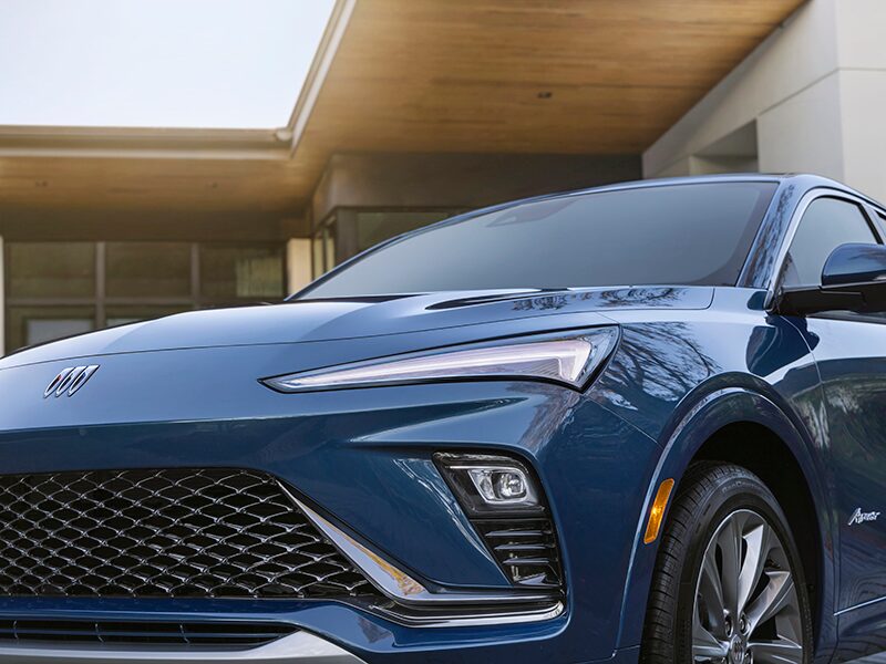 A Front Shot of the Blue Buick Envista Parked in Front of a House