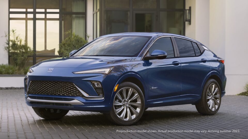 The Brand New Buick Envista in Blue Parked in a Driveway