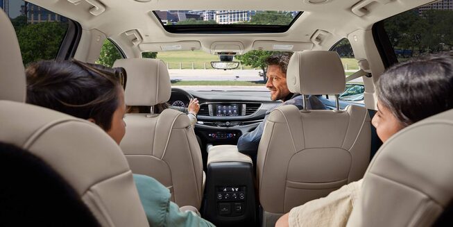 A Family Sitting in Their Buick Enclave While Driving