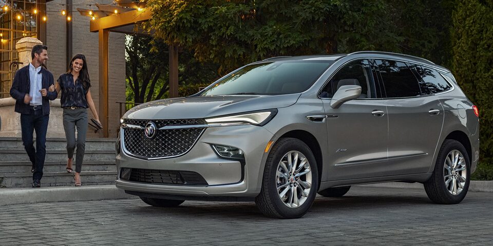 A Couple Approaches Their Buick Enclave After a Night Out Together