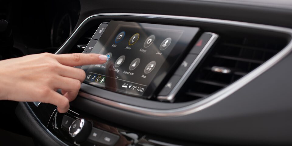 An Enclave Owner Adjusts Settings on Their Infotainment System