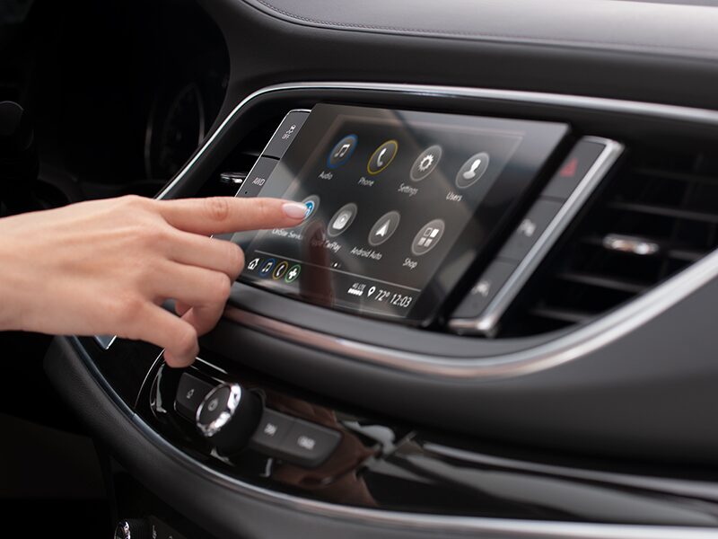 An Enclave Owner Adjusts Settings on Their Infotainment System