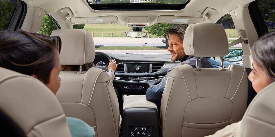 An Enclave Owner Adjusts Settings on Their Infotainment System