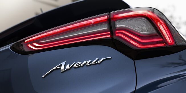 Rear Three-Quarters View Of The 2024 Buick Encore GX Avenir In Driveway