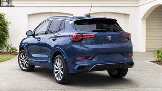 Rear Three-Quarters View Of The 2024 Buick Encore GX Avenir In Driveway