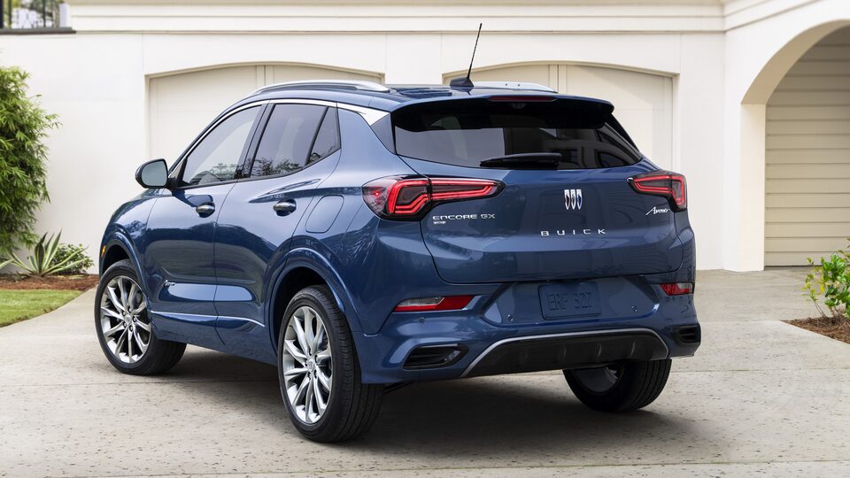 Rear Three-Quarters View Of The 2024 Buick Encore GX Avenir In Driveway