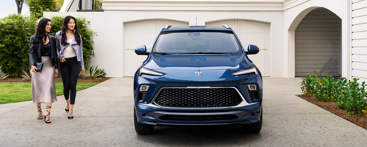 Two Friends Approach Their Buick Encore Avenir