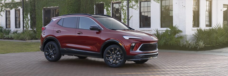 A Side Profile View of the Parked Red Buick Encore GX