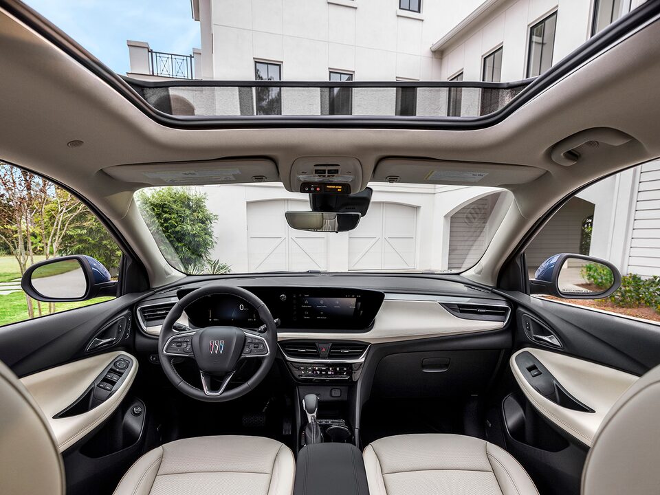 A Rear Passenger View of the Interior of the Buick Encore GX Avenir With the Sunroof Open