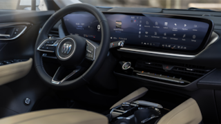 Side Interior View of the Steering Wheel, Infotainment System and Center Console in a 2024 Buick Envision