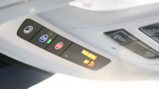 Close-up of OnStar and SOS Buttons on the top of a 2024 Buick Envision SUV