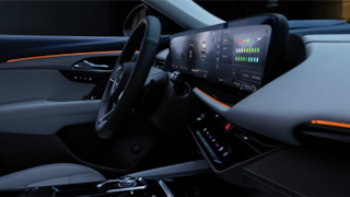 Side View of the Steering Wheel and Infotainment System in a 2024 Buick Envision