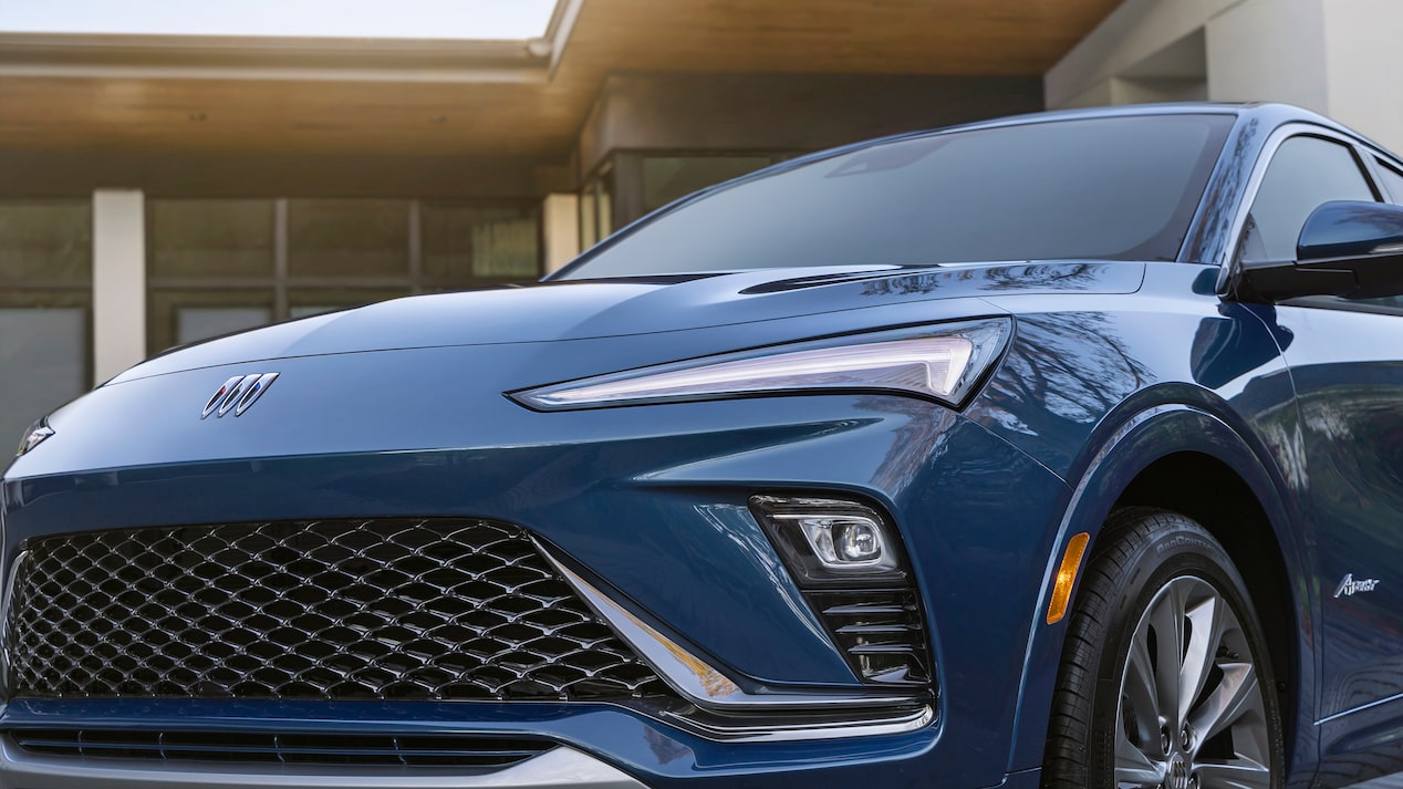 A Close-Up of the Front Grille and Front of the Buick Envista Parked in Front of a House