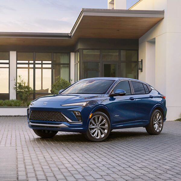 The New Buick Envista Parked in a Driveway Next to a House