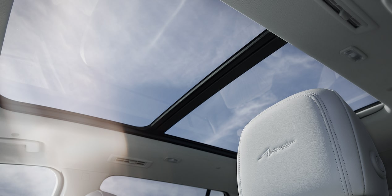 Front Seats of a 2025 Buick Enclave with Sunlight Coming from the Moonroof