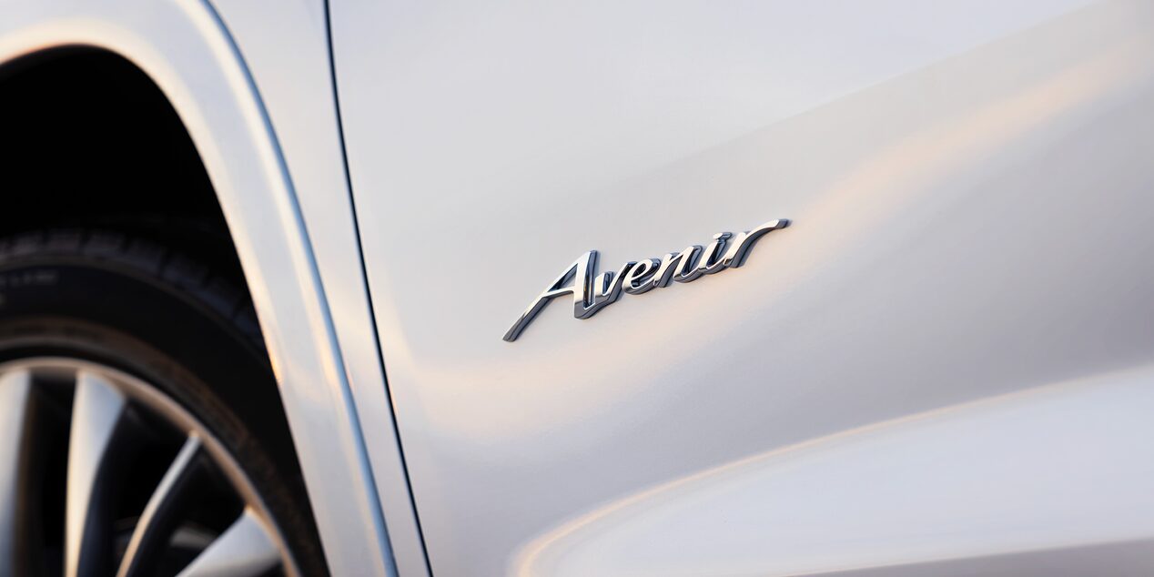 Close-Up of the Avenir Emblem on a White 2025 Enclave