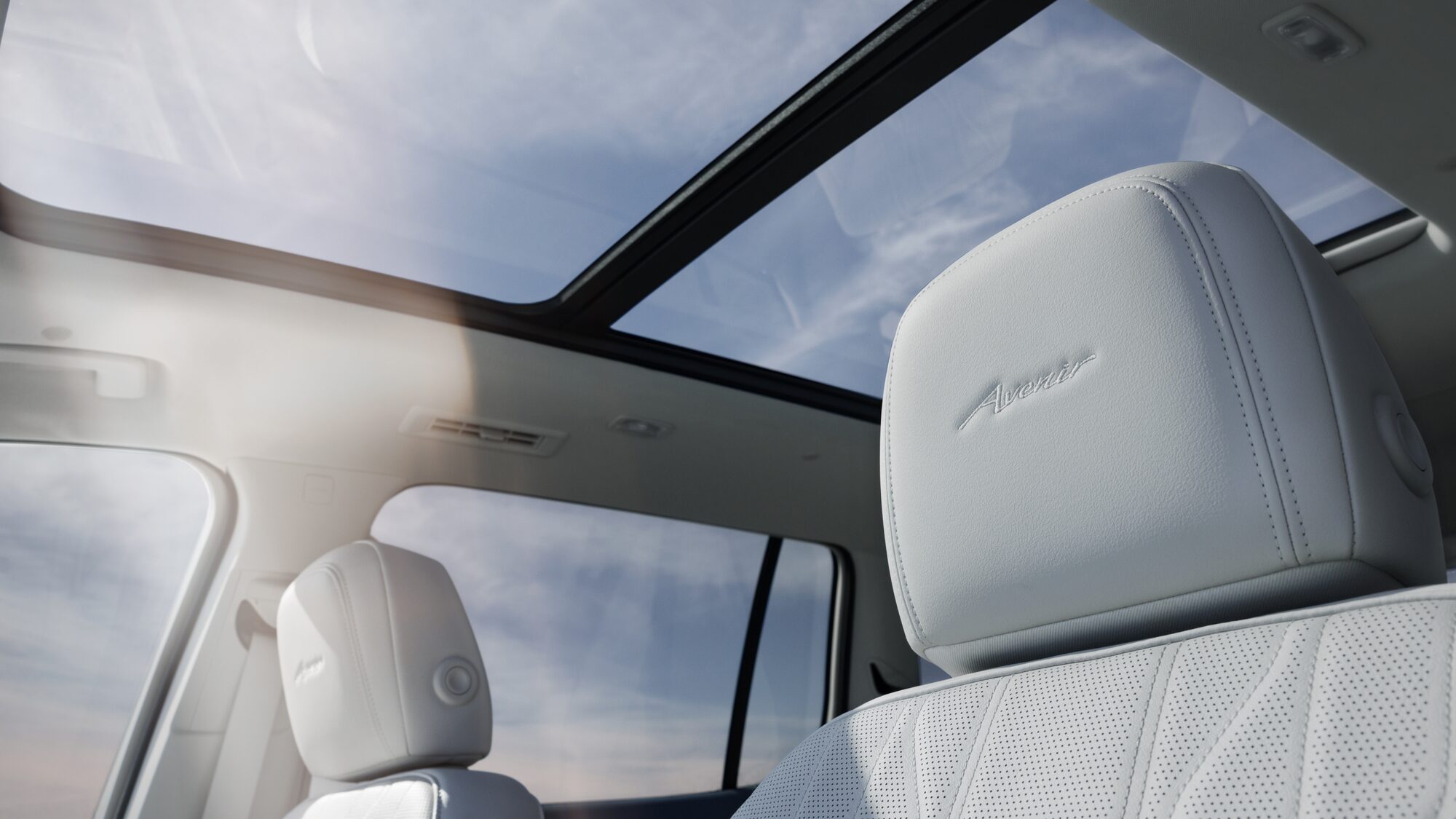 2025 Buick Enclave Avenir branded white interior.