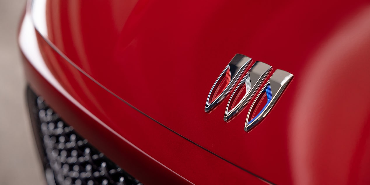 Close-up View of the Buick Emblem on a 2025 Red Enclave ST