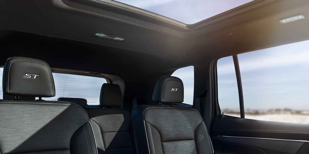 Interior View of a 2025 Buick Enclave with the Roof Shade Open and Sunlight Coming Through