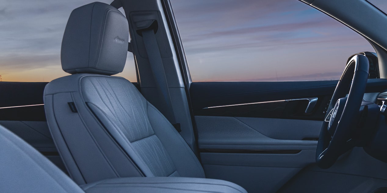 Side View of the Driver's Seat in a 2025 Buick Enclave under Evening Sky