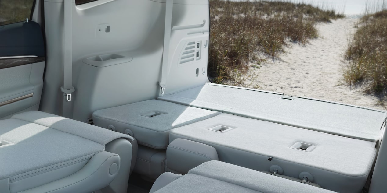 A View from the Interior with the Trunk Open in a 2025 Buick Enclave and a Trail Leading to the Beach