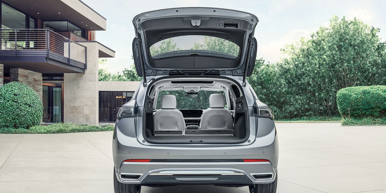 Wide Rear View of the 2025 Buick Envision Avenir Luxury SUV with the Trunk Open