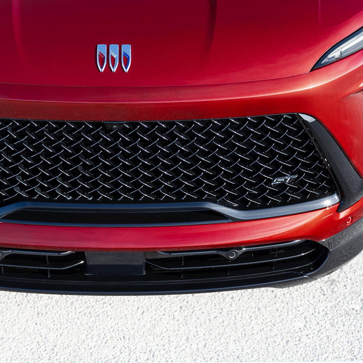 Overhead View of a the Hood and Grille of a 2026 Red Buick Enclave