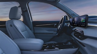 Front Passenger View of a Steering Wheel and Display Dashboard inside a 2026 Buick Enclave