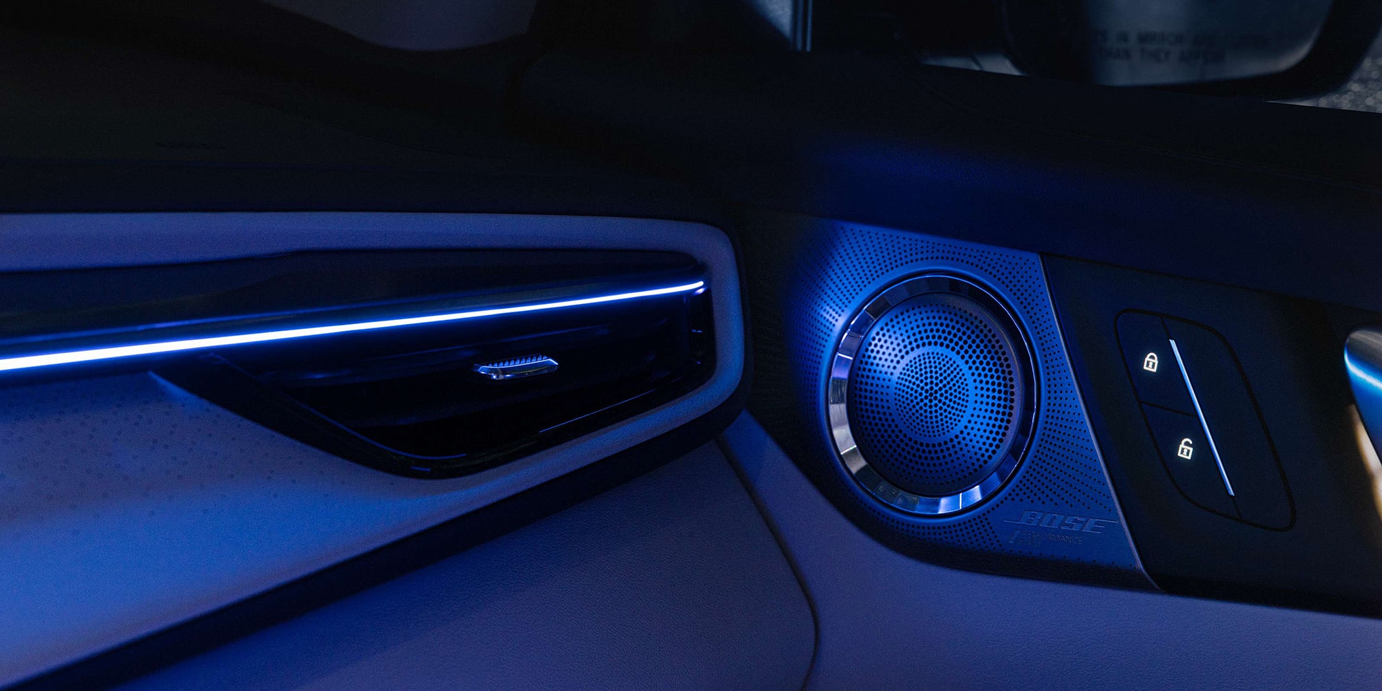 Close-up of the Speaker Attached to the Door Illuminated by Neon Lights inside of a 2026 Buick Enclave