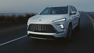 Close-up of a 2026 White Buick Enclave Front Hood with a Focus on the Front Light