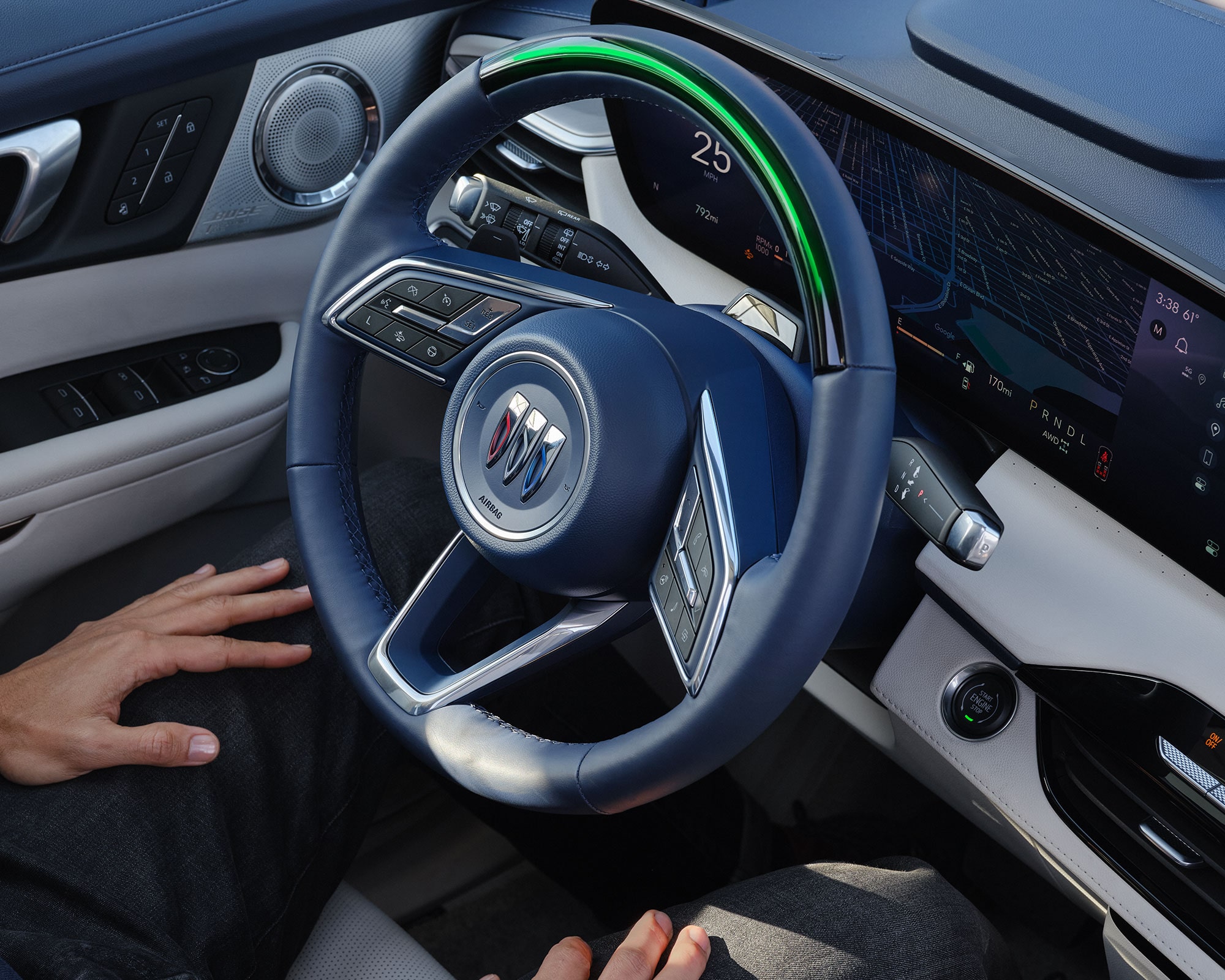 Interior View of the Driver of a Buick Enclave Using Super Cruise Hands-Free Driving Technology