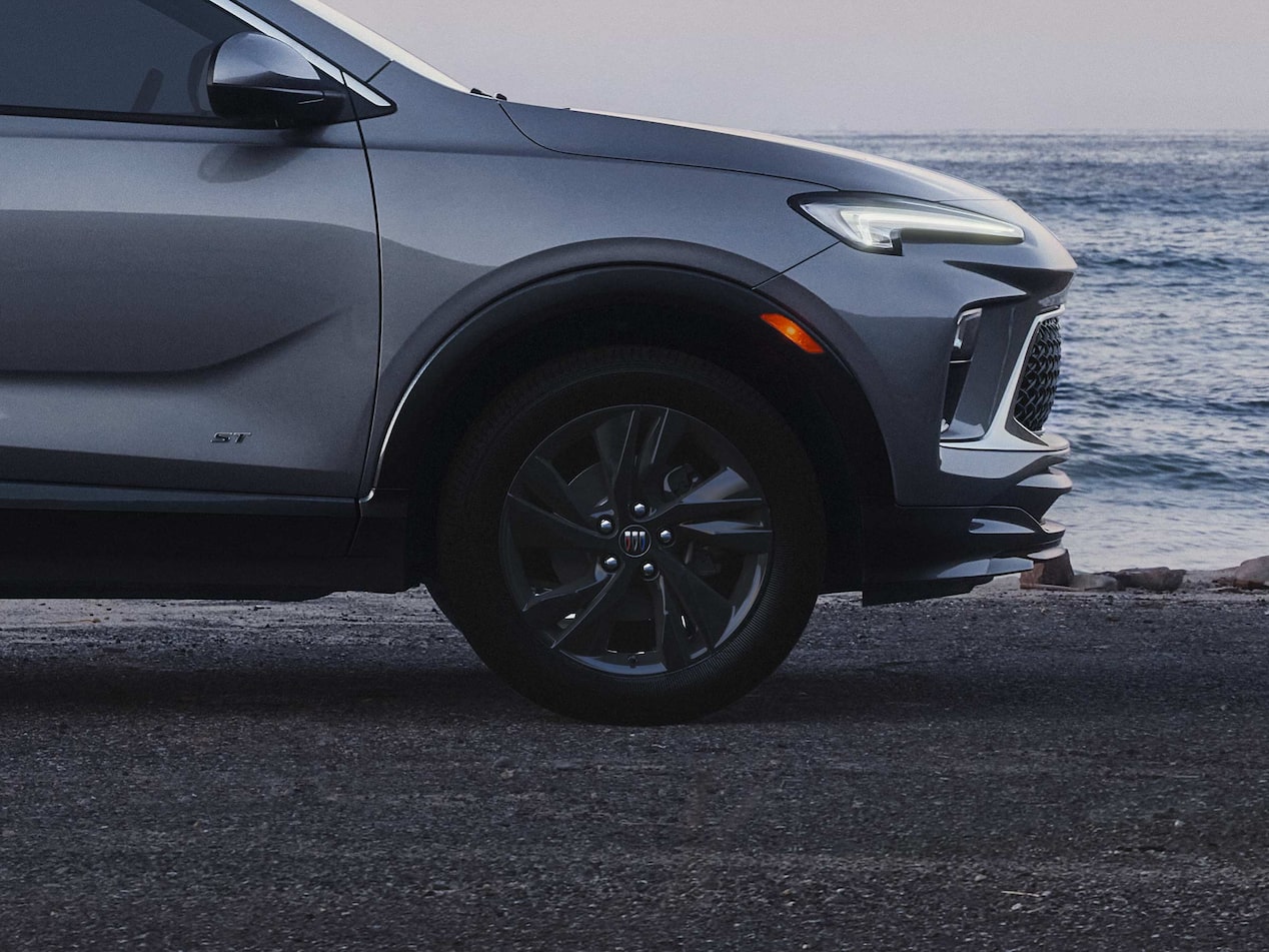 Exterior Profile View of the Buick 2026 Encore GX ST Sporty SUV Parked on a Beach