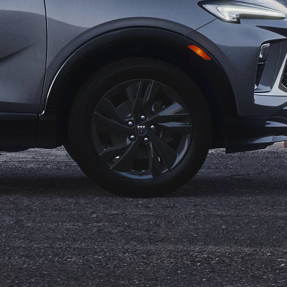 Exterior Profile View of the Buick 2026 Encore GX ST Sporty SUV Parked on a Beach